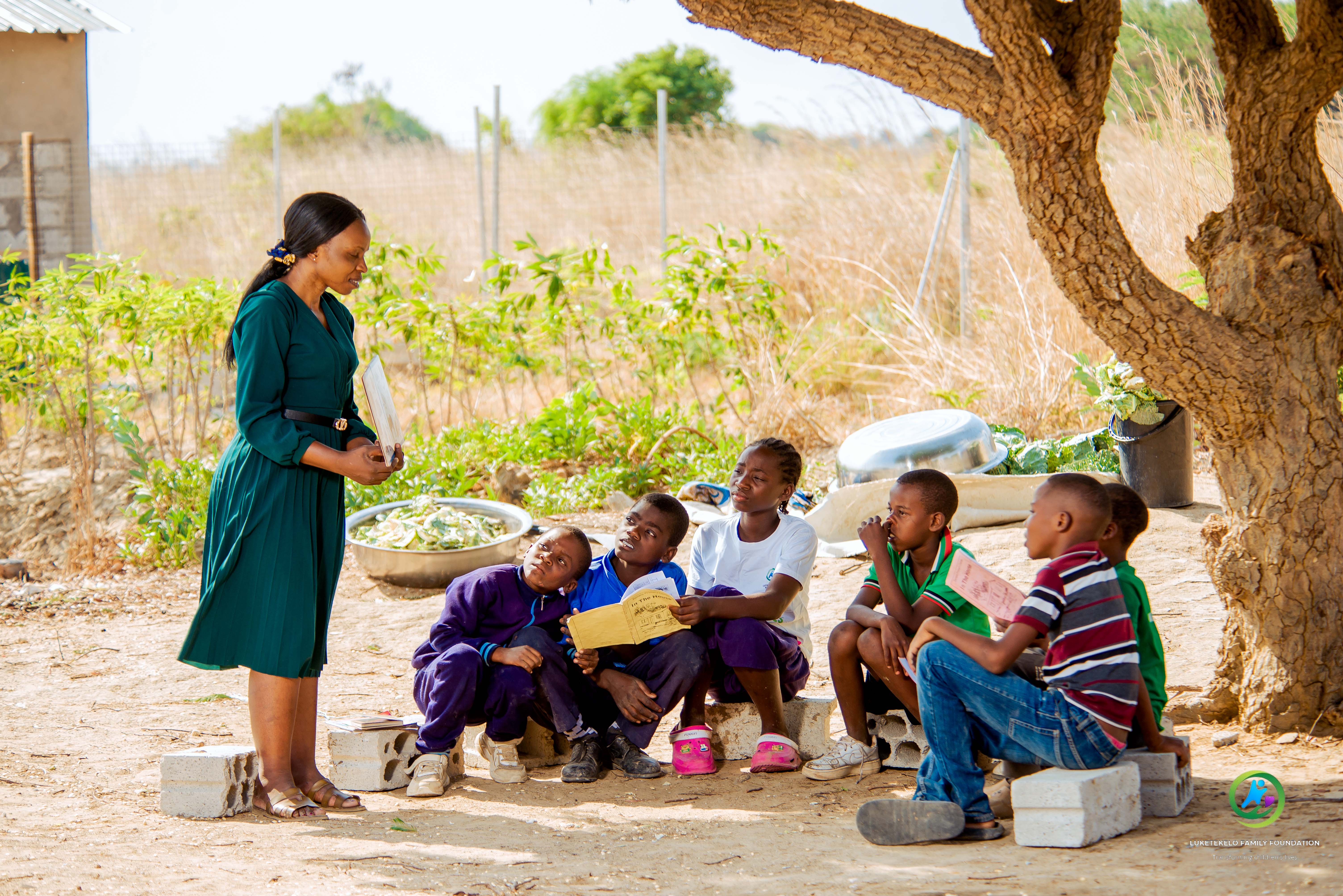 Families from Faith Family Foundation gathering at a community event in Zambia